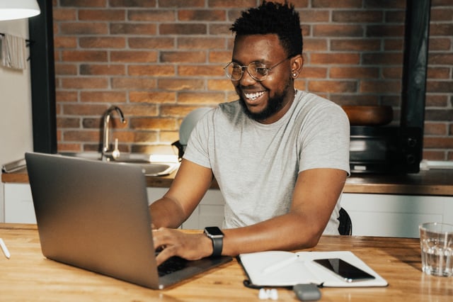 A happy men at the laptop